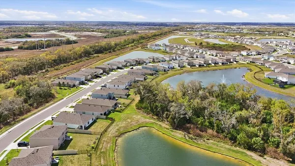 a view of a lake with a yard