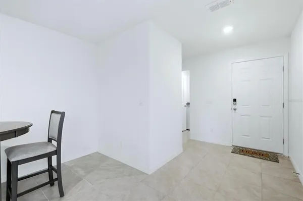 a view of a room with table and chair