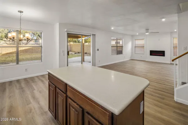 a view of kitchen island with tub and wooden floor