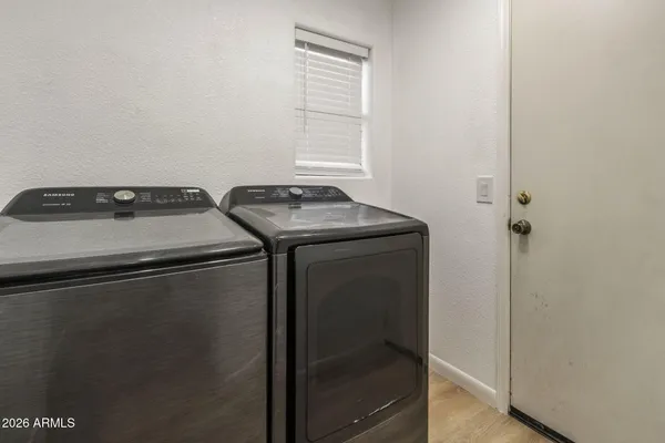 a utility room with dryer and washer