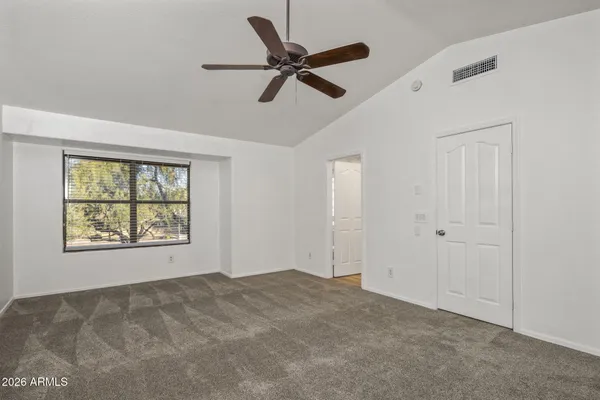a view of an empty room with a window