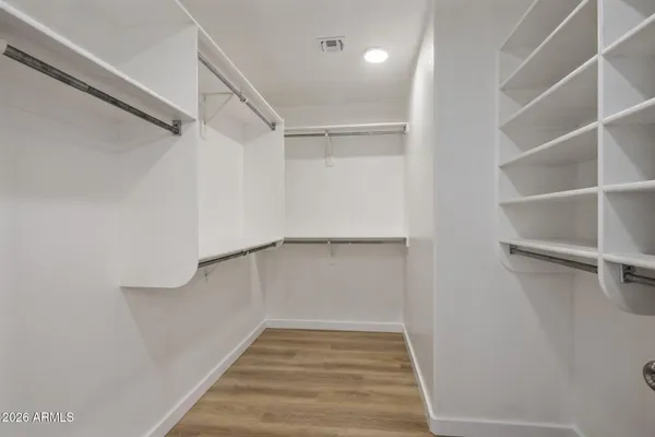a view of an empty walk in closet