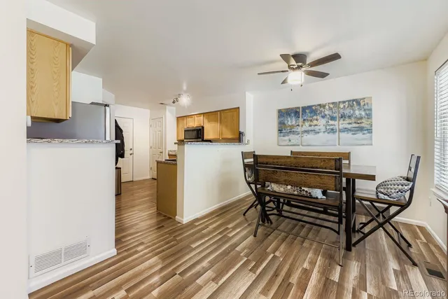 a dining room with furniture and a window