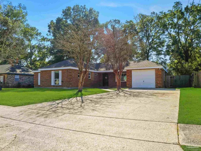 a house with trees in front of it