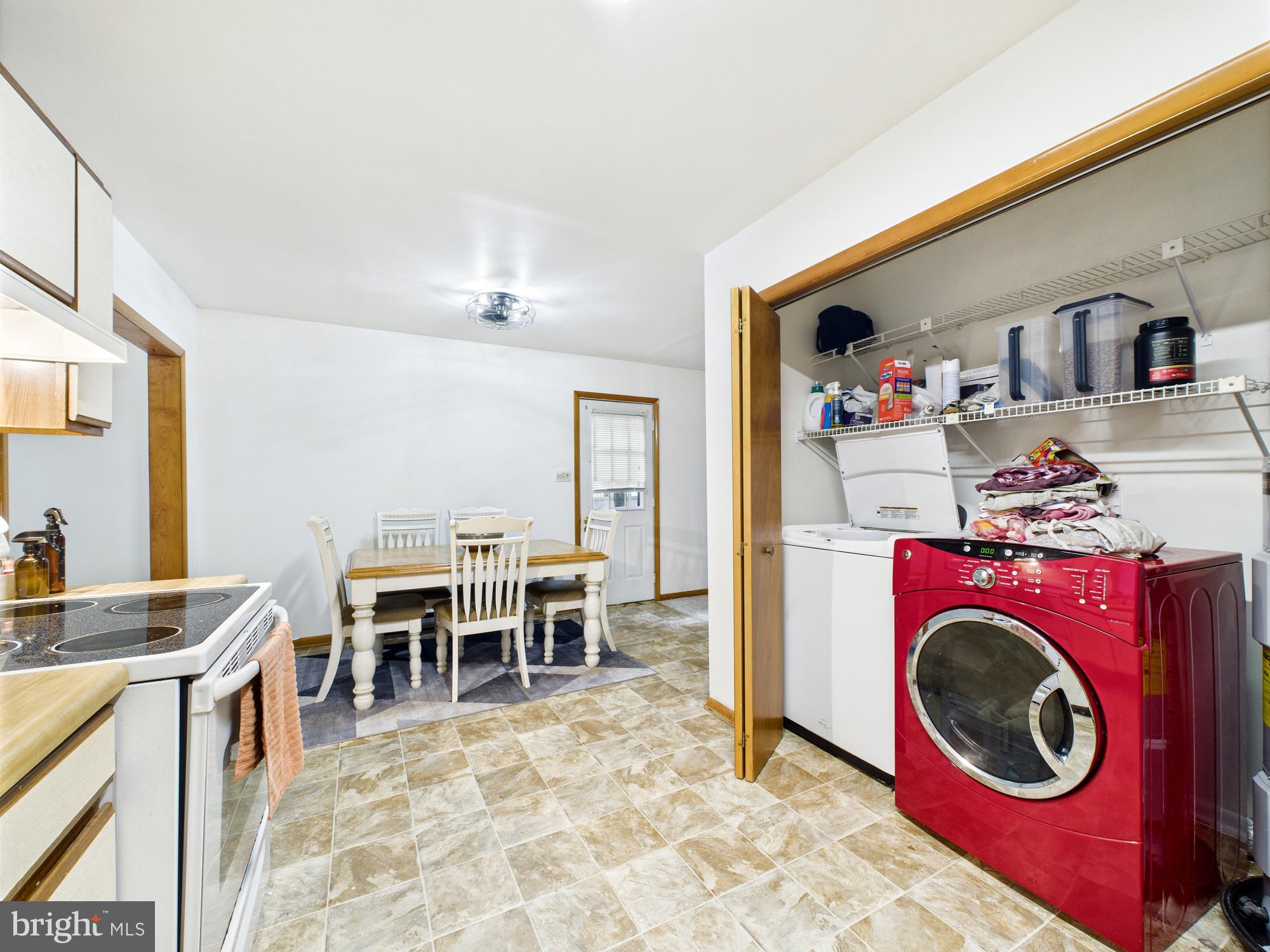 22915 Angola Road West Lewes, DE 19958 - Photo 11 of 32 a view of a dining room with furniture and washer dryer