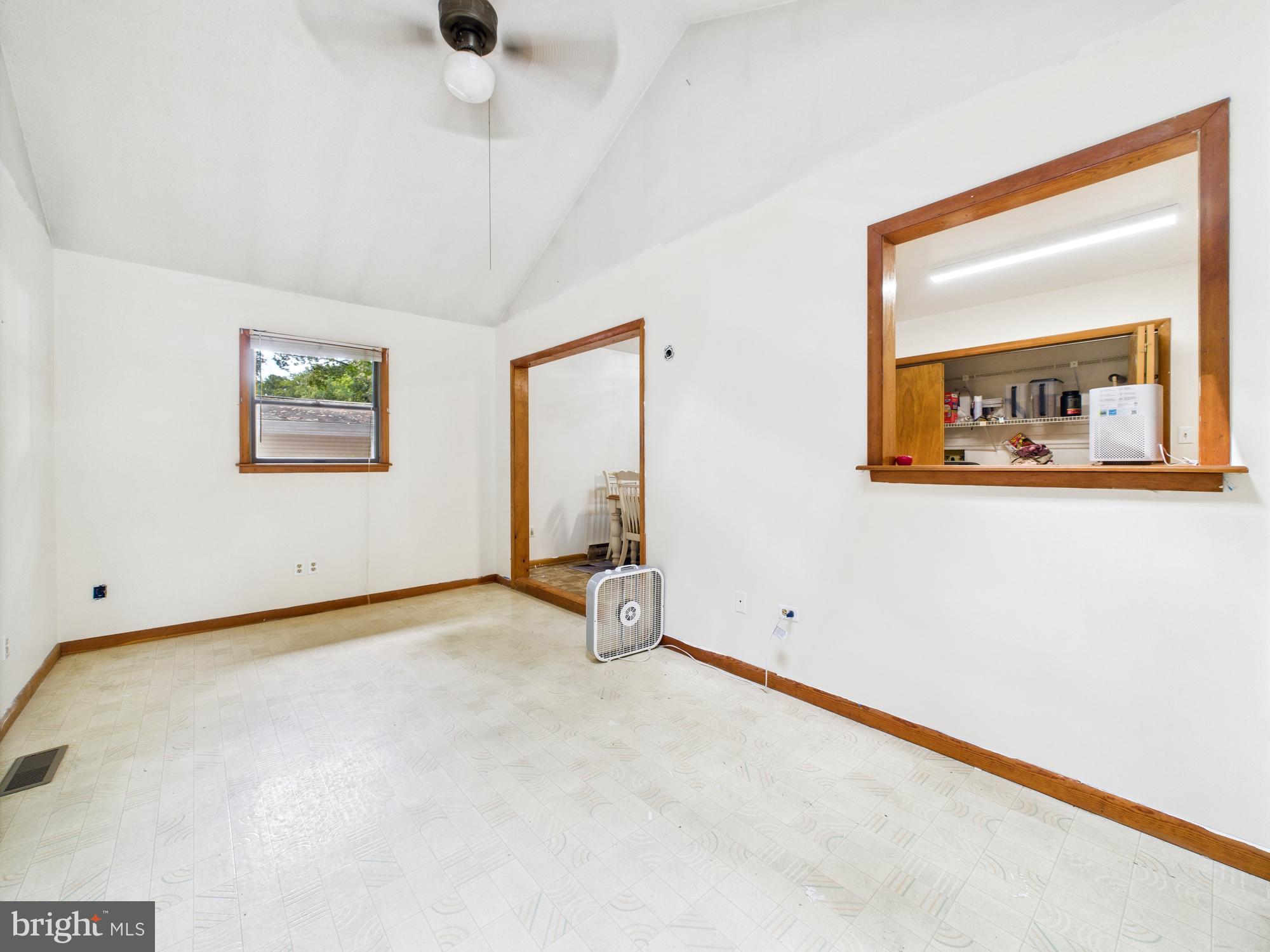 22915 Angola Road West Lewes, DE 19958 - Photo 12 of 32 a view of an empty room with a window