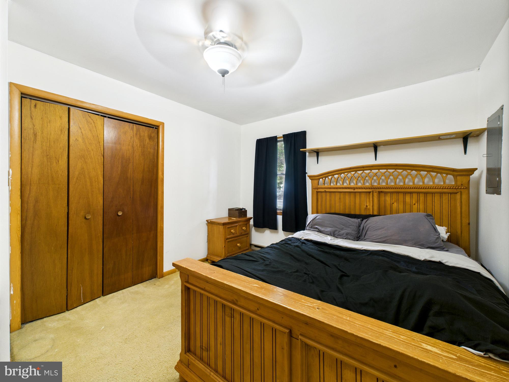 22915 Angola Road West Lewes, DE 19958 - Photo 15 of 32 a bedroom with a bed and a dresser