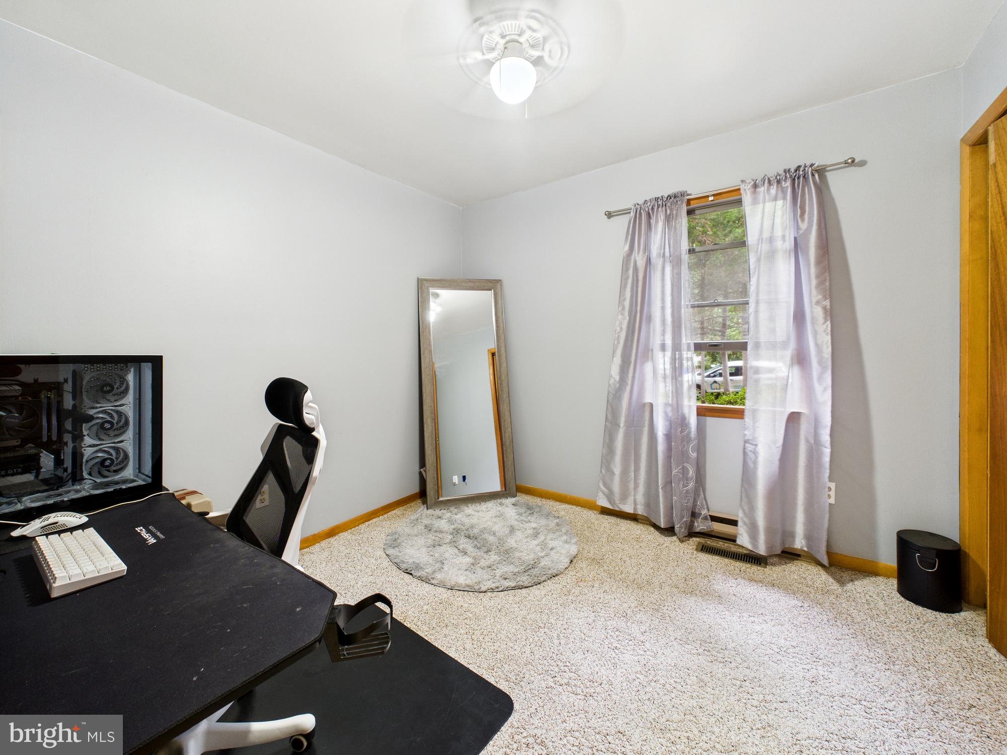 22915 Angola Road West Lewes, DE 19958 - Photo 18 of 32 a room with furniture and a window