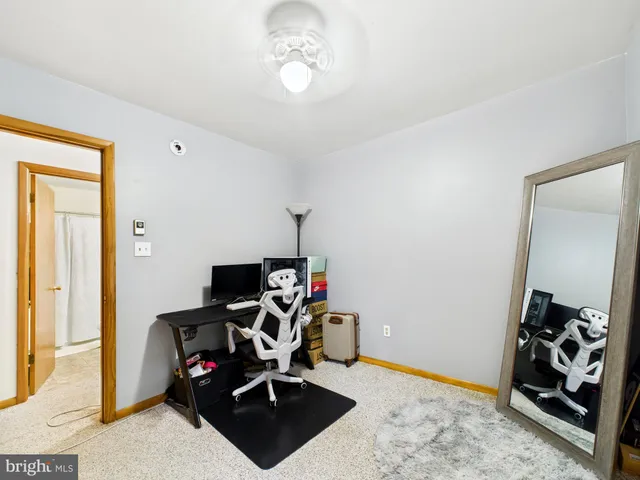 a bathroom with a sink a toilet and shower curtain