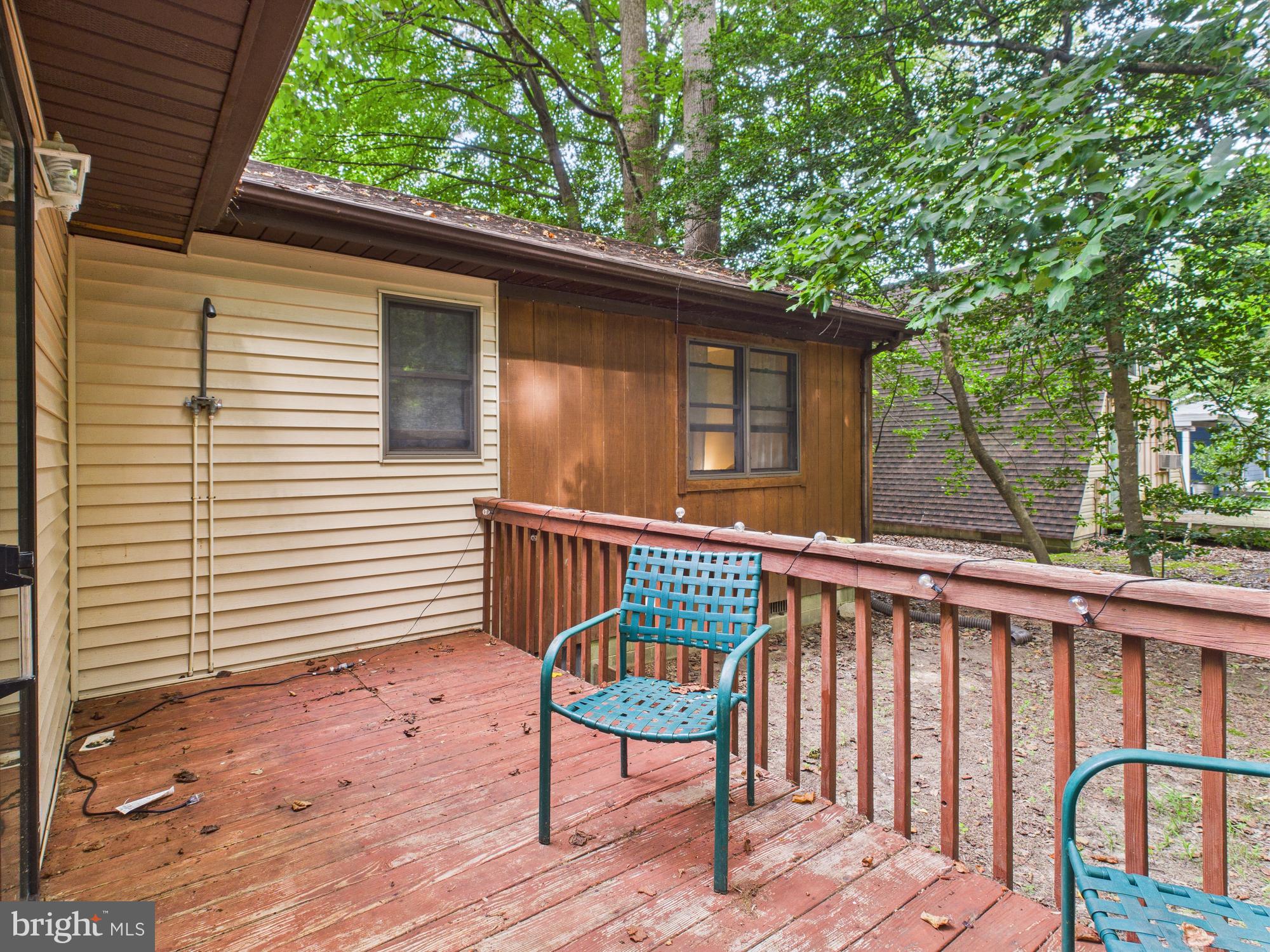 22915 Angola Road West Lewes, DE 19958 - Photo 23 of 32 a view of a wooden deck and a backyard