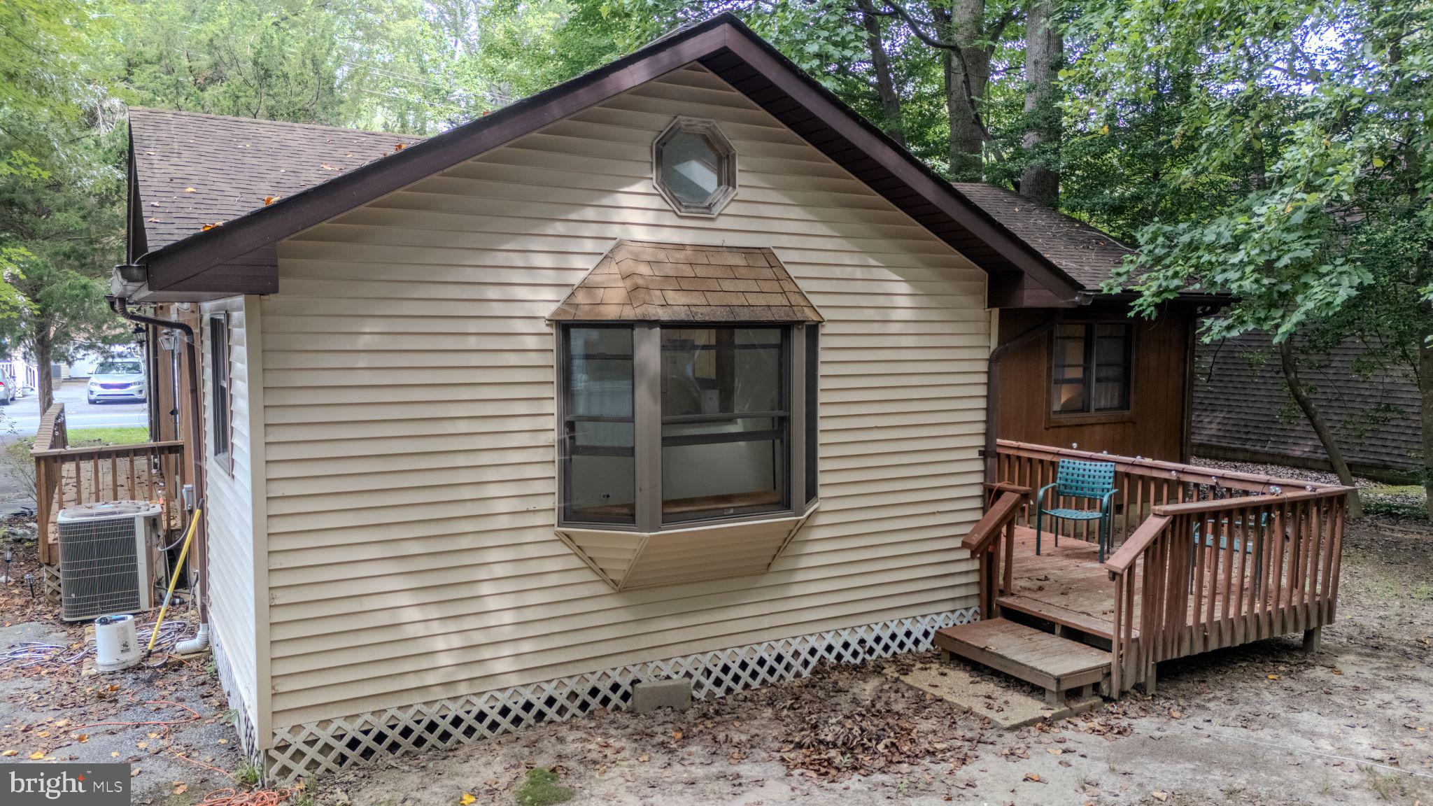 22915 Angola Road West Lewes, DE 19958 - Photo 28 of 32 a view of a small house with a yard