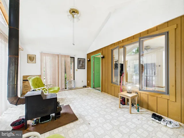 a living room with furniture and next to a window