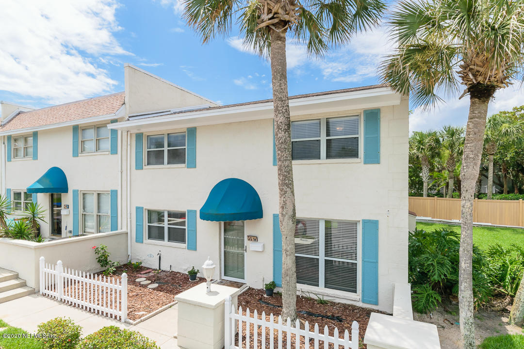2233 Seminole Road, Unit 30 Atlantic Beach, FL 32233 - Photo 1 of 29 a front view of a house with a yard and porch