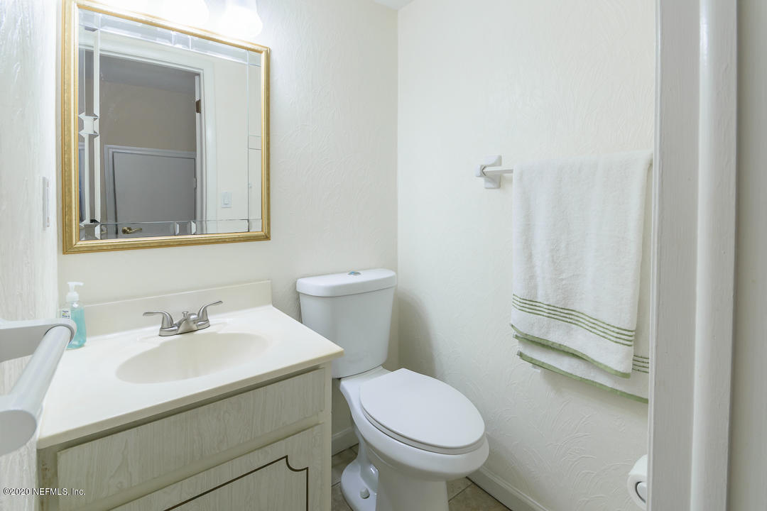 2233 Seminole Road, Unit 30 Atlantic Beach, FL 32233 - Photo 13 of 29 a bathroom with a sink toilet and vanity
