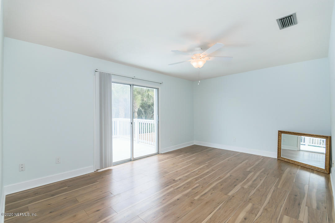 2233 Seminole Road, Unit 30 Atlantic Beach, FL 32233 - Photo 15 of 29 an empty room with wooden floor and windows
