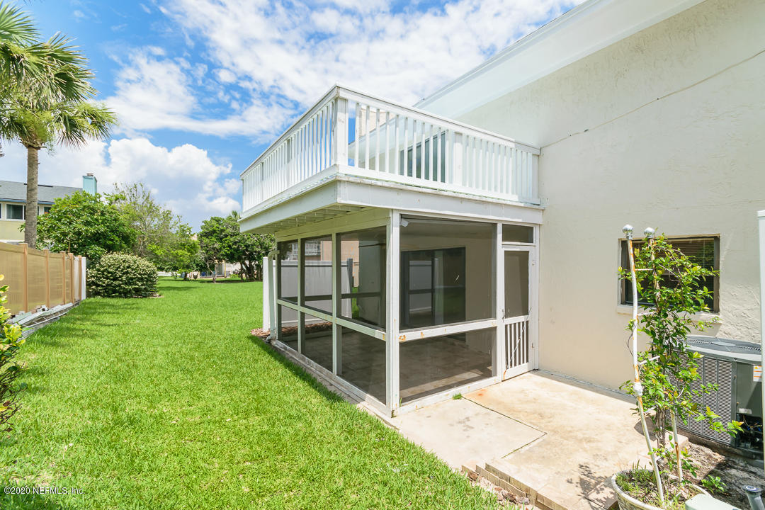 2233 Seminole Road, Unit 30 Atlantic Beach, FL 32233 - Photo 23 of 29 a front view of a house with a yard