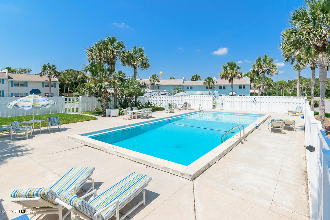 2233 Seminole Road, Unit 30 Atlantic Beach, FL 32233 - Photo 28 of 29 a view of a swimming pool with a patio and a yard
