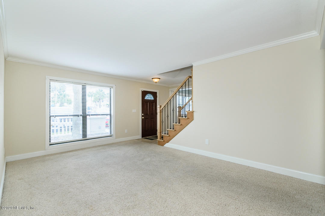 2233 Seminole Road, Unit 30 Atlantic Beach, FL 32233 - Photo 5 of 29 an empty room with windows