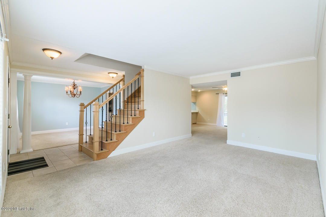 2233 Seminole Road, Unit 30 Atlantic Beach, FL 32233 - Photo 6 of 29 a view of a hallway with staircase