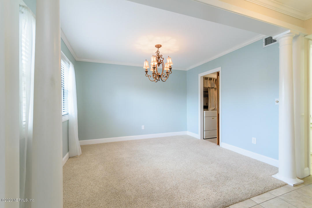 2233 Seminole Road, Unit 30 Atlantic Beach, FL 32233 - Photo 7 of 29 a view of an empty room with window and chandelier