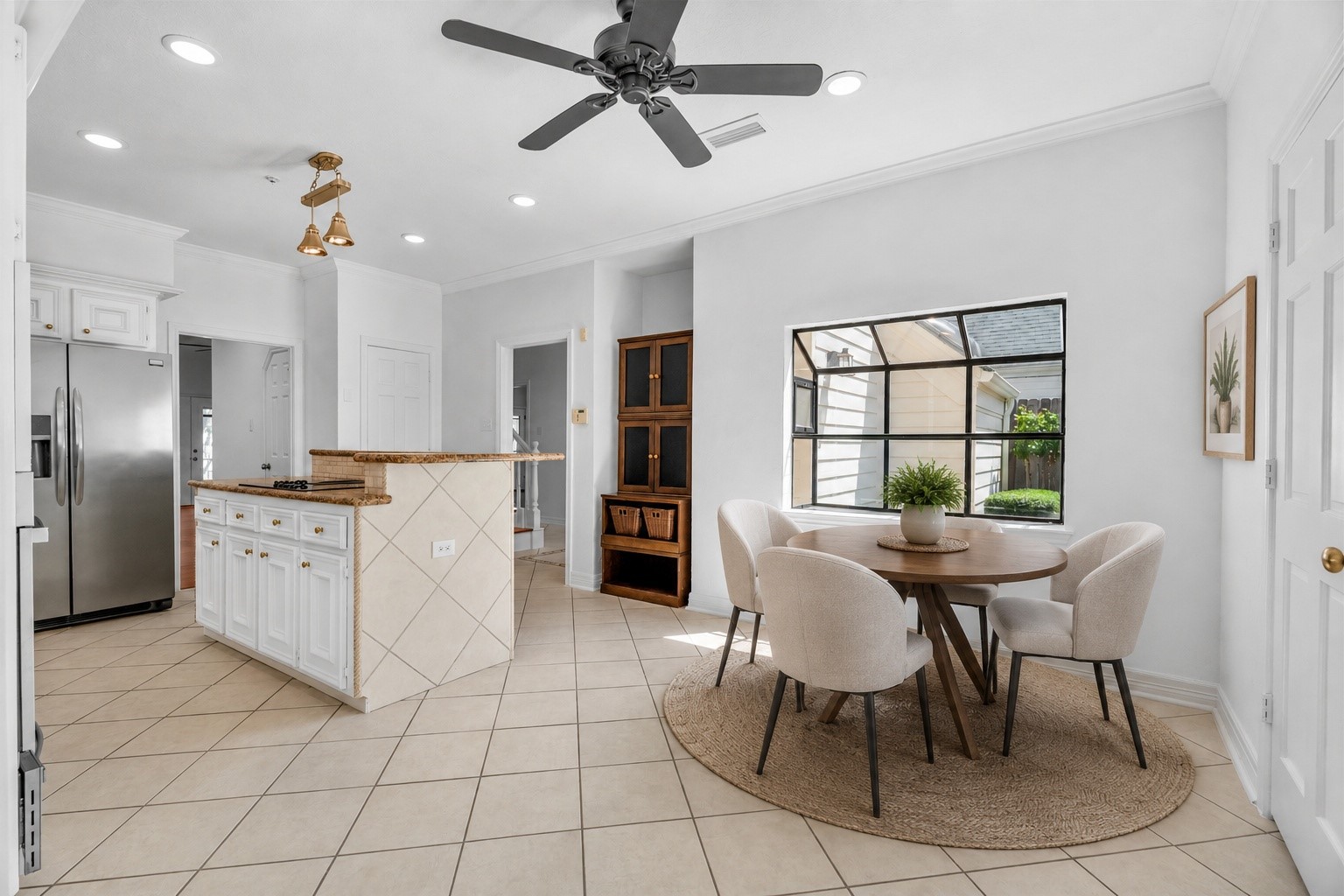 7635 Ameswood Road Houston, TX 77095 - Photo 18 of 39 Casual dining area in the kitchen plus bar seating, extra storage and sunny window.