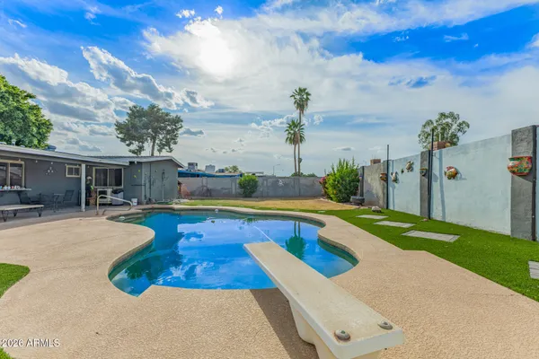 a view of a house with swimming pool