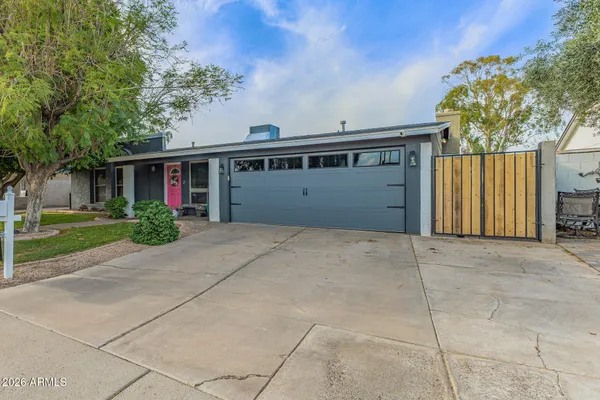 a view of backyard space and garage