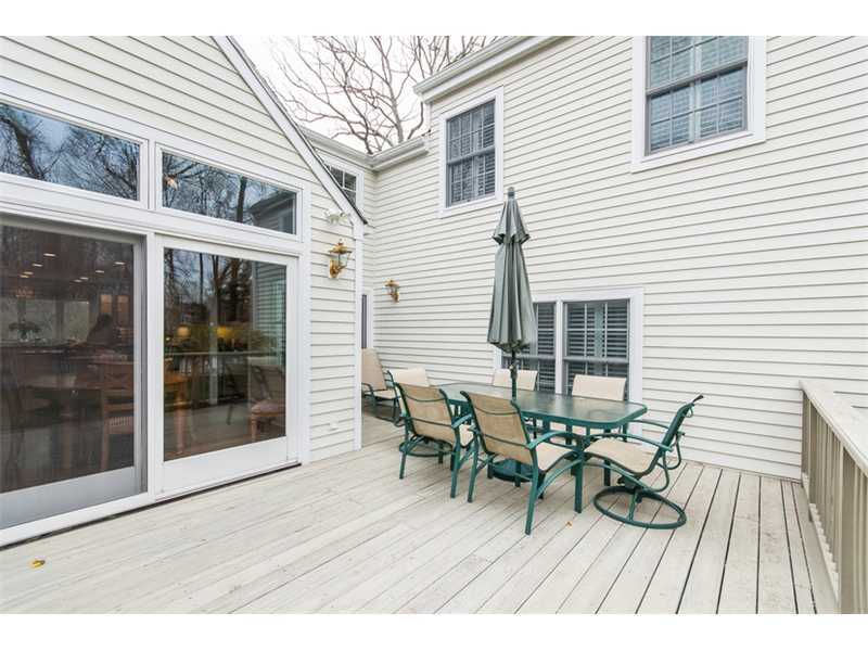 15 Old Stone Road Darien, CT 06820 - Photo 17 of 22 a view of a patio with table and chairs and floor to ceiling window