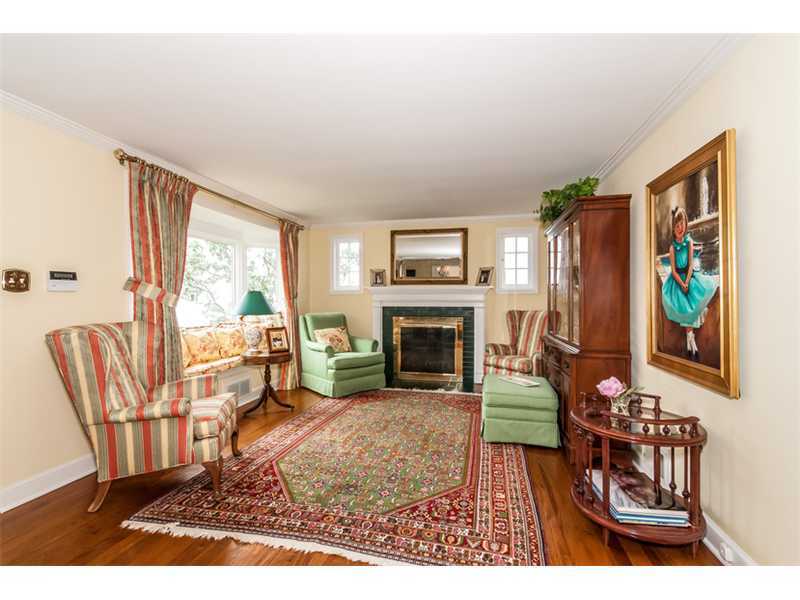15 Old Stone Road Darien, CT 06820 - Photo 2 of 22 a living room with furniture a fireplace and a large window