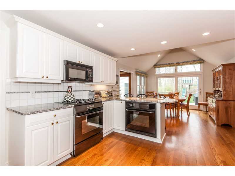 15 Old Stone Road Darien, CT 06820 - Photo 5 of 22 a kitchen with a stove a sink and a microwave