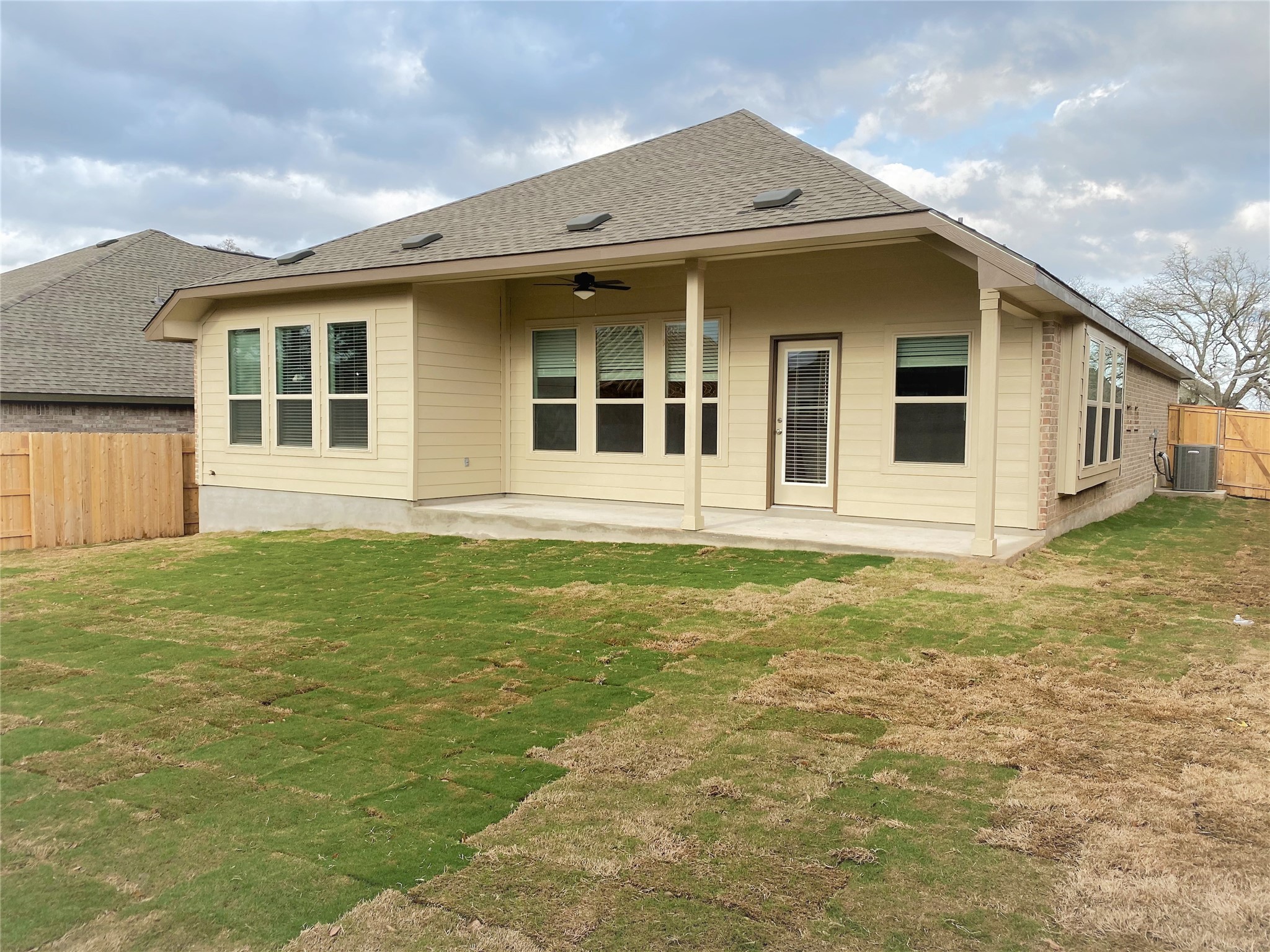 1309 Terrace View Georgetown, TX 78628 - Photo 34 of 36 A newly sodded lawn offers a refreshing view from the sheltered back patio of this inviting home.
