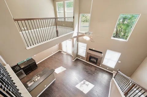 a view of living room with furniture and a fireplace