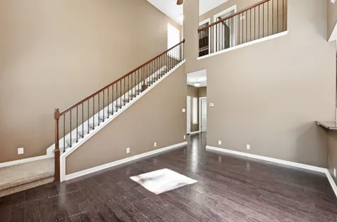 a view of entryway with stairs and wooden floor