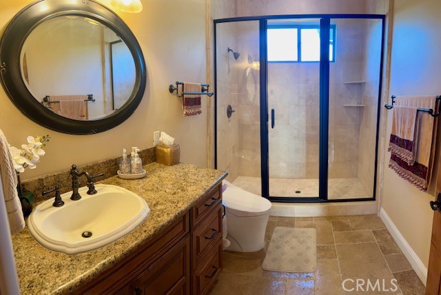 775 Riata Lane Nipomo, CA 93444 - Photo 14 of 40 a bathroom with a sink and a mirror