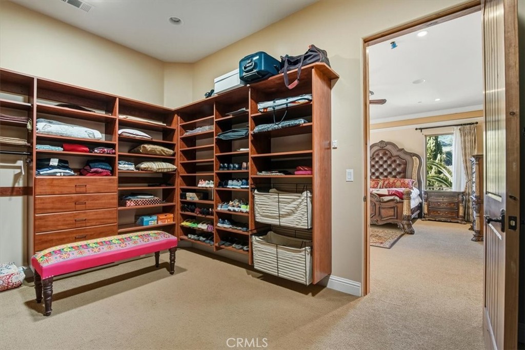 775 Riata Lane Nipomo, CA 93444 - Photo 15 of 48 a view of walk in closet with clothes and shoes