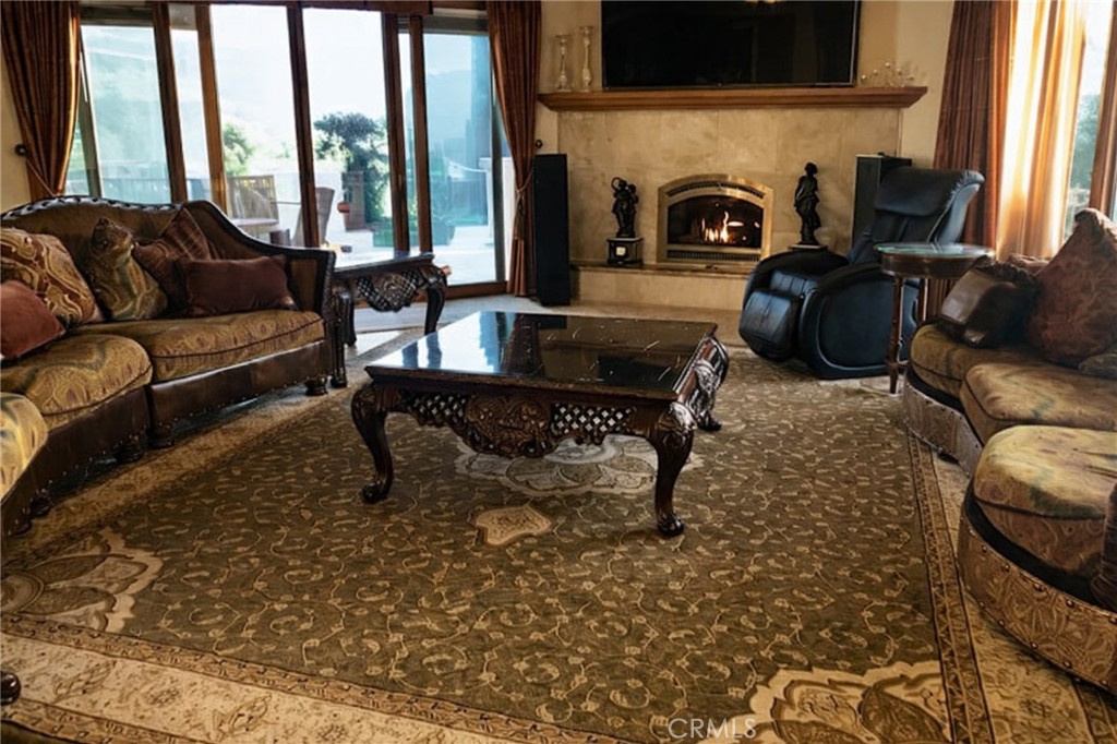 775 Riata Lane Nipomo, CA 93444 - Photo 15 of 40 a living room with furniture and a fireplace