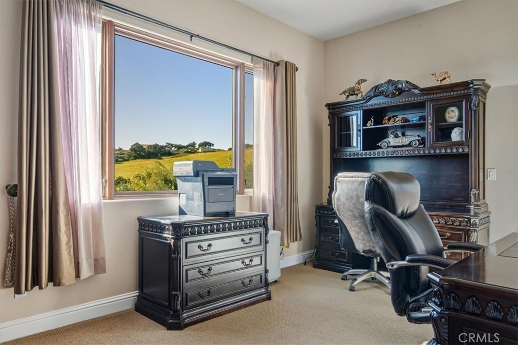 775 Riata Lane Nipomo, CA 93444 - Photo 16 of 48 a view of a workspace with furniture and a window