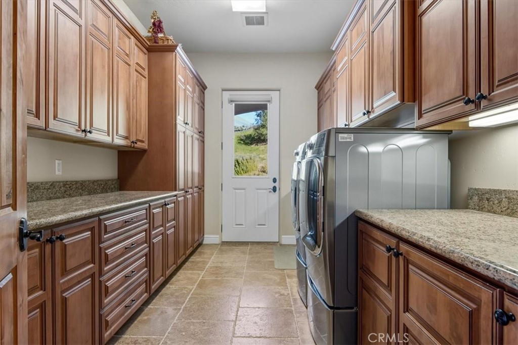 775 Riata Lane Nipomo, CA 93444 - Photo 19 of 48 a kitchen with stainless steel appliances granite countertop a refrigerator and a sink