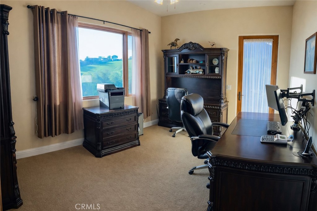 775 Riata Lane Nipomo, CA 93444 - Photo 21 of 40 a view of a workspace with furniture and a window