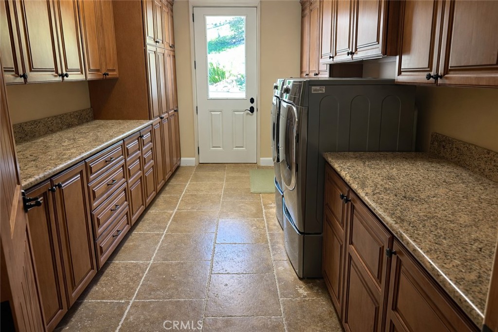 775 Riata Lane Nipomo, CA 93444 - Photo 22 of 40 a kitchen with granite countertop a refrigerator and a sink