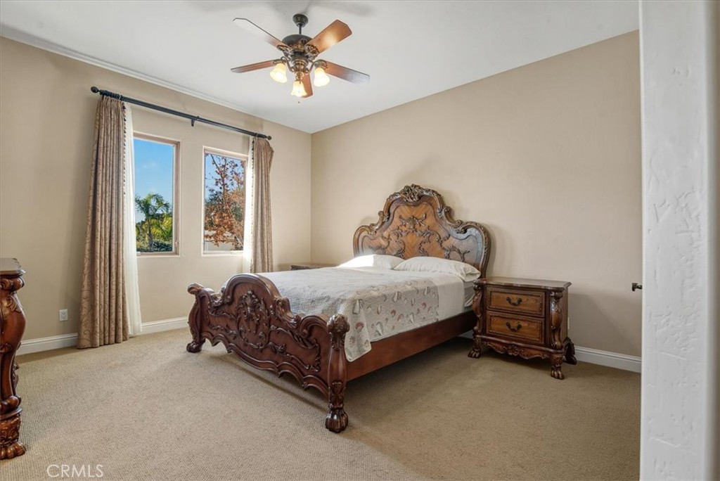 775 Riata Lane Nipomo, CA 93444 - Photo 25 of 48 a bed sitting in a spacious bedroom next to a window