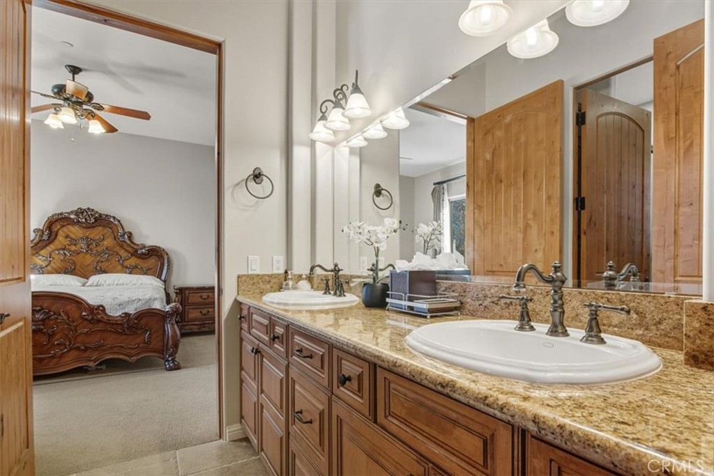775 Riata Lane Nipomo, CA 93444 - Photo 26 of 48 a en suite bathroom with a double vanity sink and a mirror