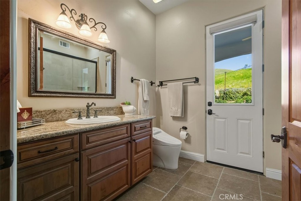 775 Riata Lane Nipomo, CA 93444 - Photo 29 of 48 Downstairs powder bath with shower, tub and access to rear yard