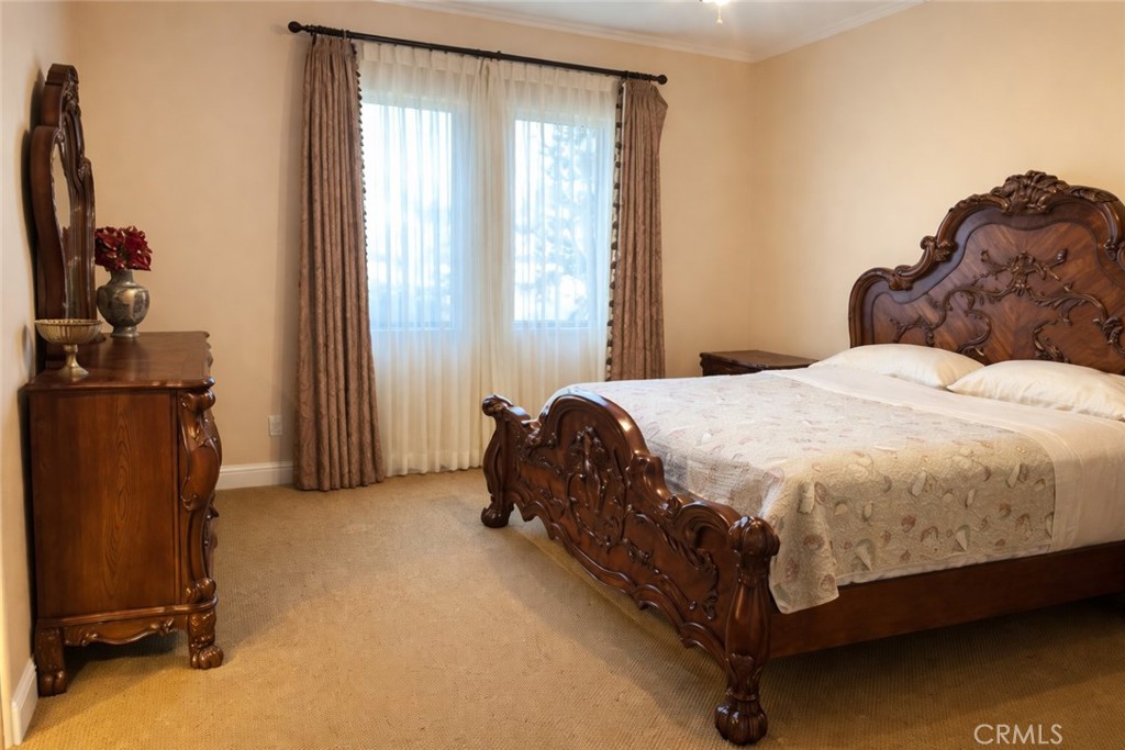 775 Riata Lane Nipomo, CA 93444 - Photo 30 of 40 a spacious bedroom with a bed and a window
