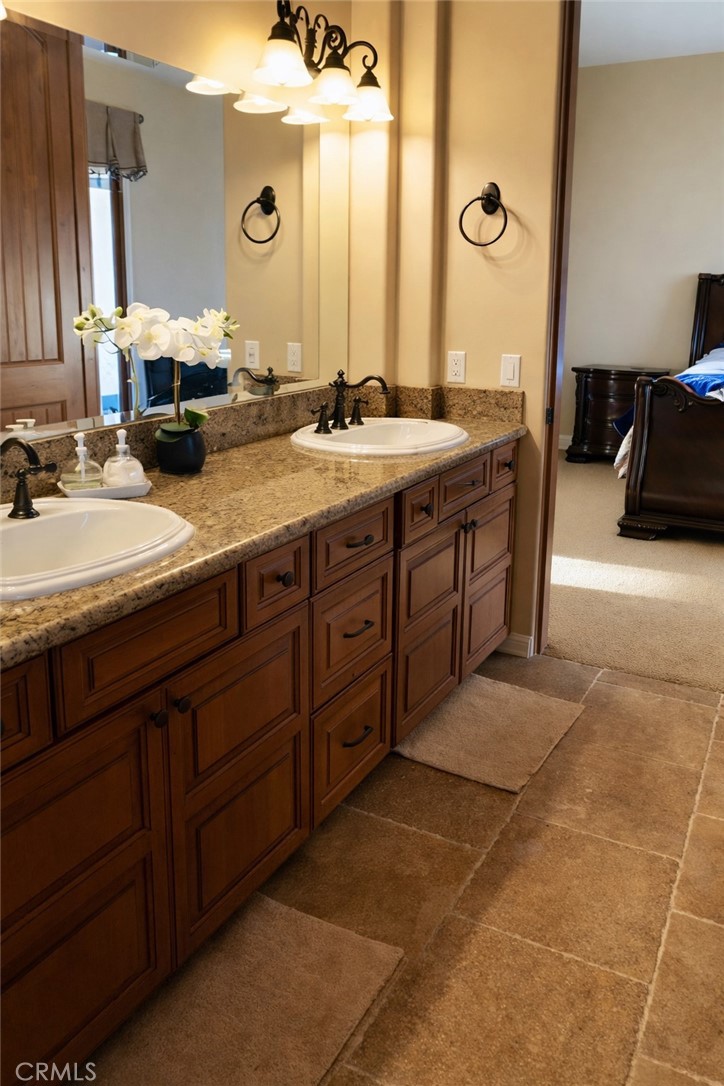 775 Riata Lane Nipomo, CA 93444 - Photo 33 of 40 a bathroom with a double vanity sink and a mirror