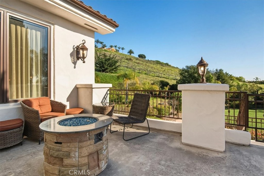 775 Riata Lane Nipomo, CA 93444 - Photo 40 of 48 a view of a chairs and table in the back yard of the house