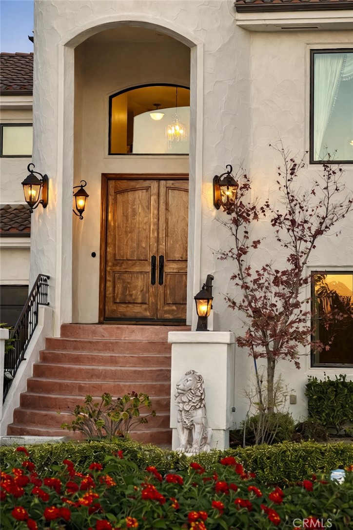775 Riata Lane Nipomo, CA 93444 - Photo 42 of 48 a view of a front door of the house and flowers