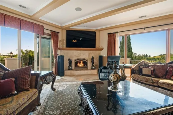 a view of a livingroom with furniture window and wooden floor