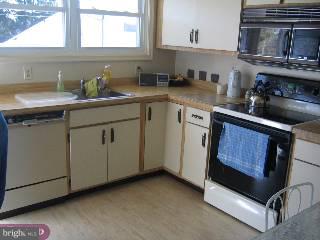 268 Frederick Road Havertown, PA 19083 - Photo 3 of 6 a kitchen with stainless steel appliances granite countertop a sink stove and cabinets