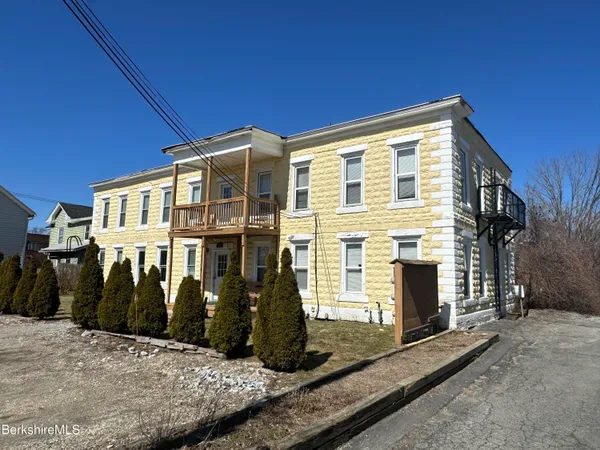a front view of a house with street